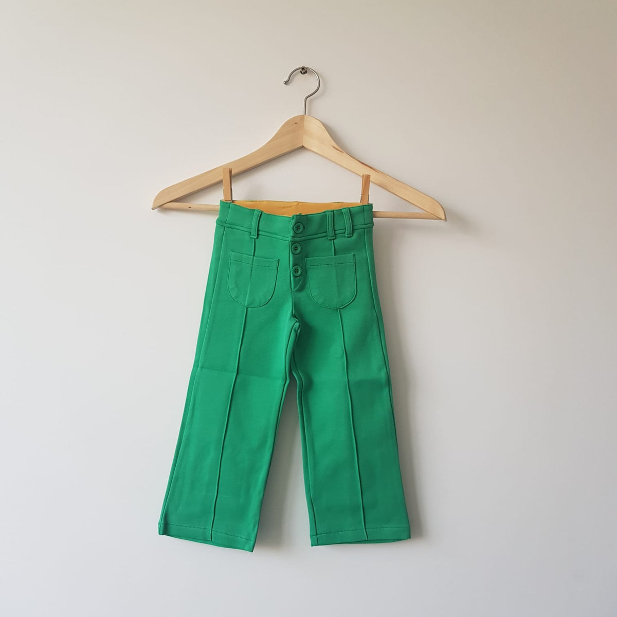 This is a Color - Pants Flared Green Green Pants with wide legs